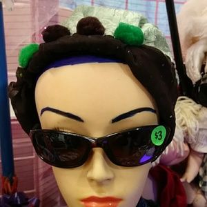 a green and Brown hat. some children to USA grey a